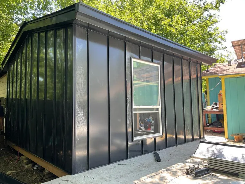 Black standing seam metal wall panels for Roof Inspection in Happy Valley