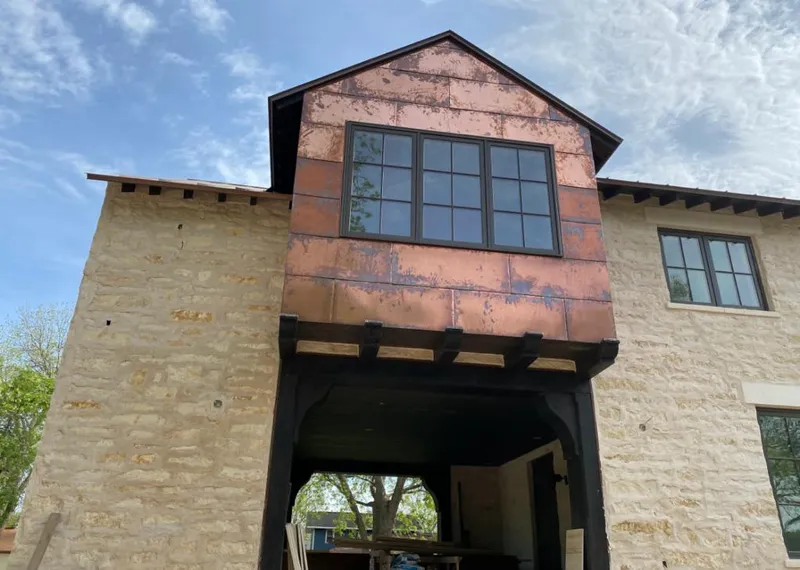 Copper metal panel facade on a stone building for Metal Roof Coating in Happy Valley